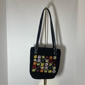 Liz Claiborne black floral woven shoulder purse. Nylon with pvc trim. Zip pocket